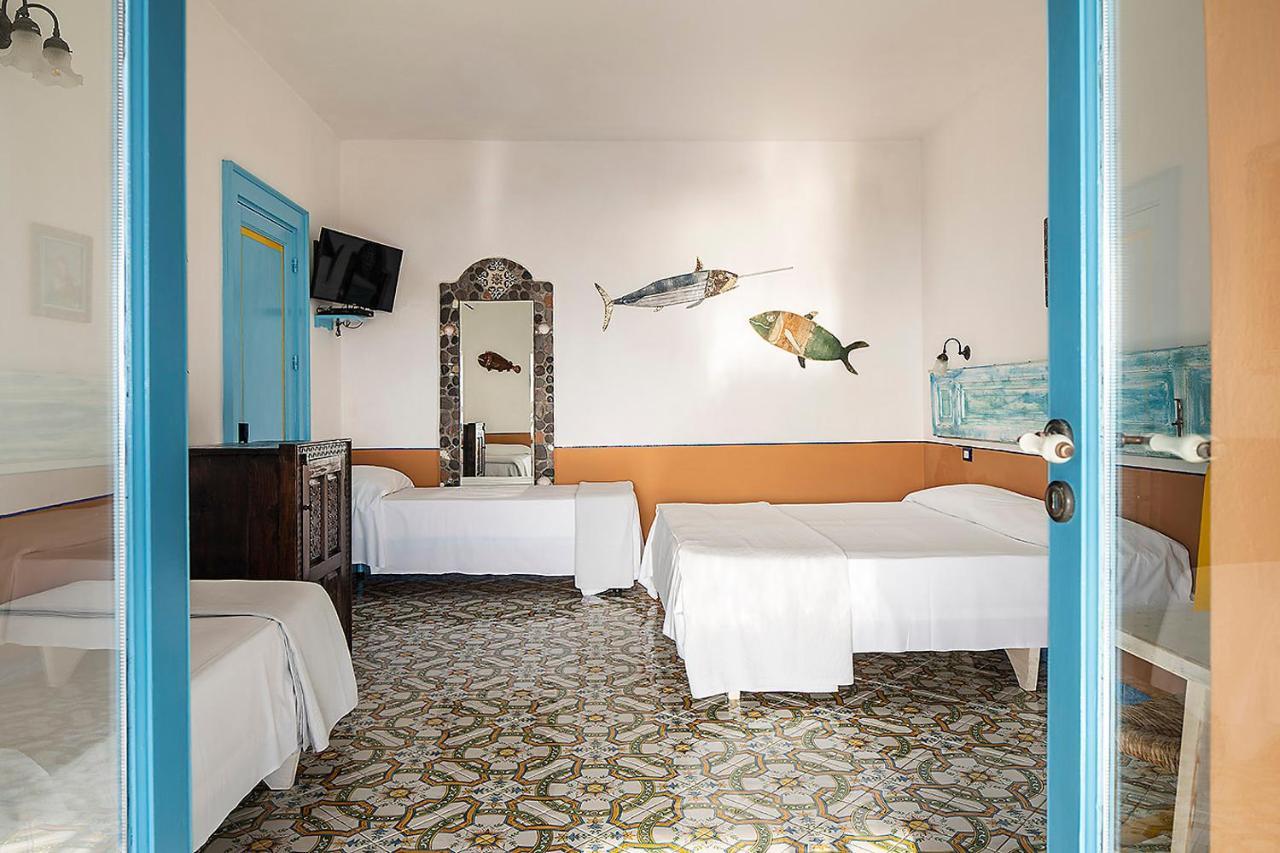Habitación Cuádruple Deluxe con terraza y vistas al mar