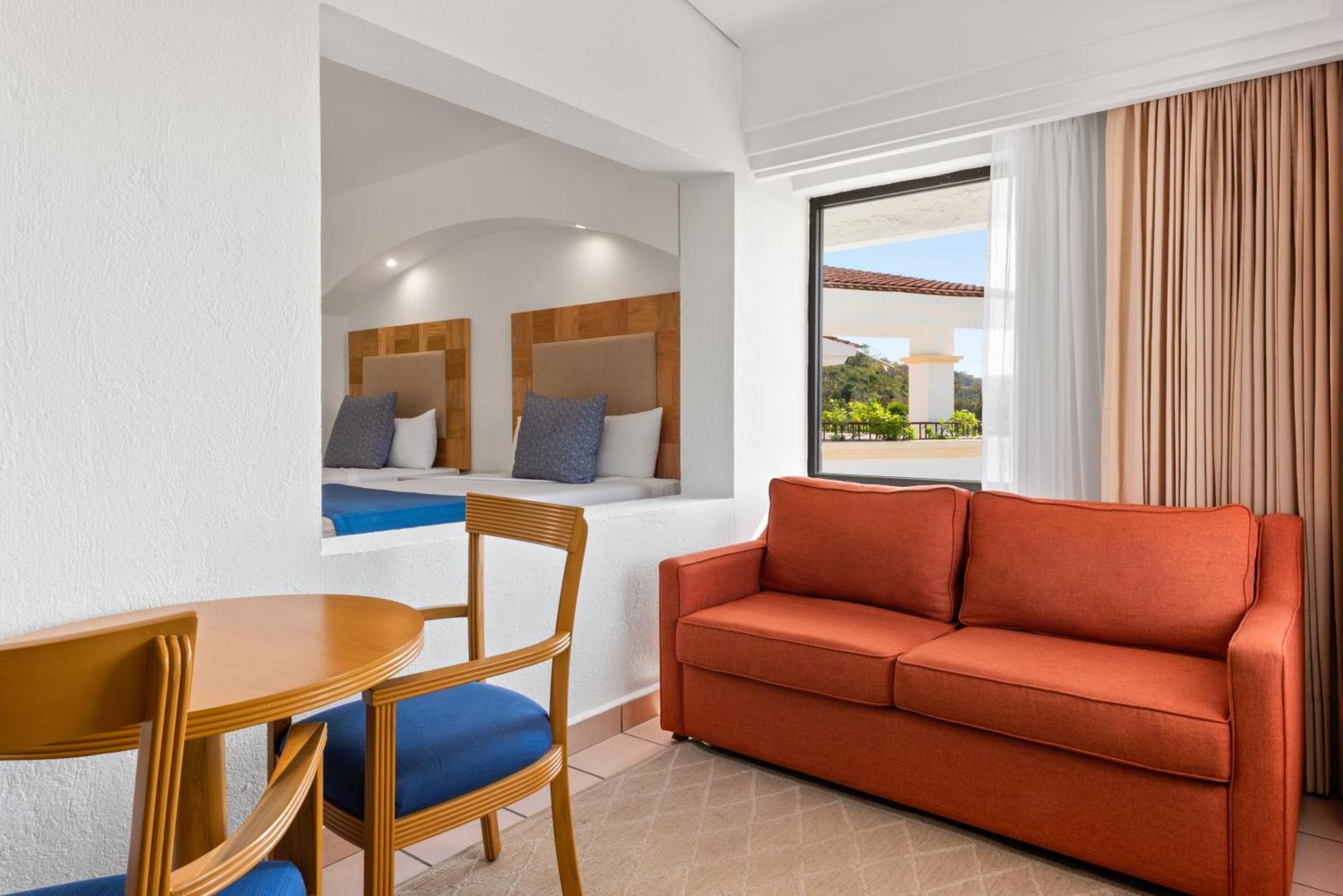Deluxe Double Room with Two Double Beds, Sofa Bed, Terrace, Pool Access and Ocean View