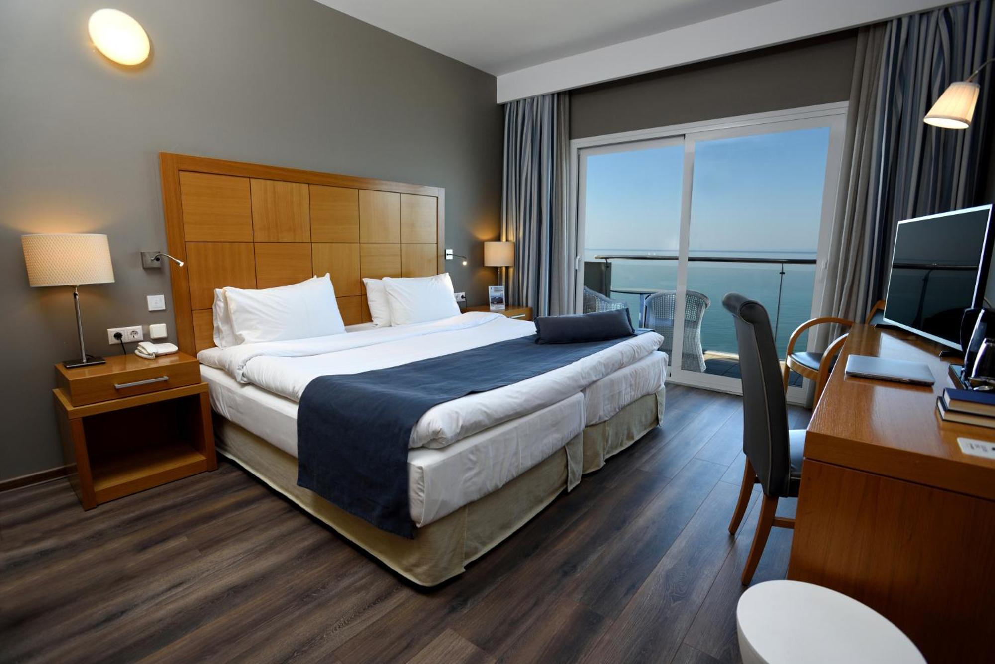 Kamer met Nereid Coco-Mat en Uitzicht op Zee