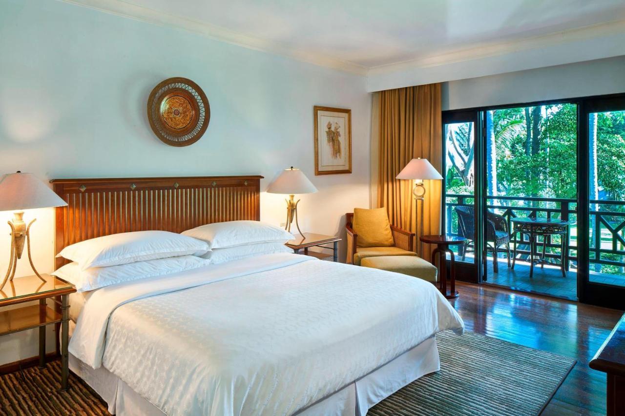 Habitación doble deluxe con cama grande y vistas al jardín