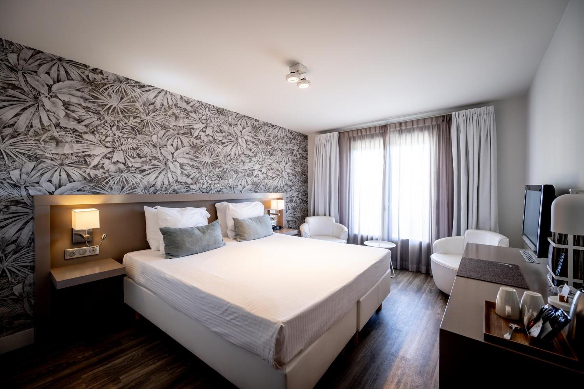 Comfort room with garden view and balcony