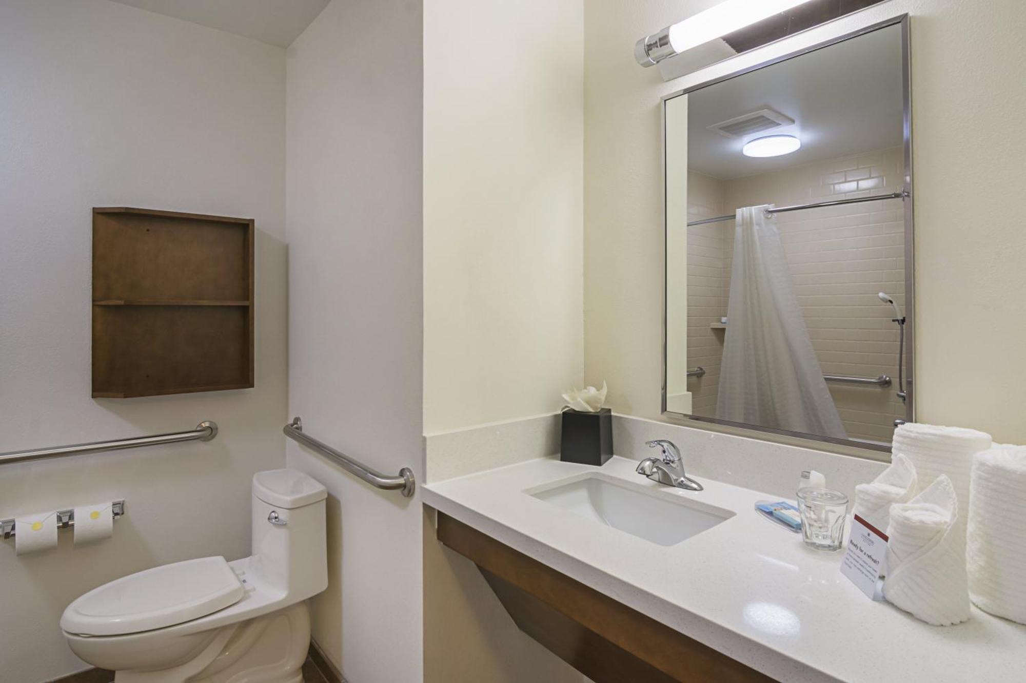 Queen Studio Suite with Roll In Shower - Mobility Accessible
