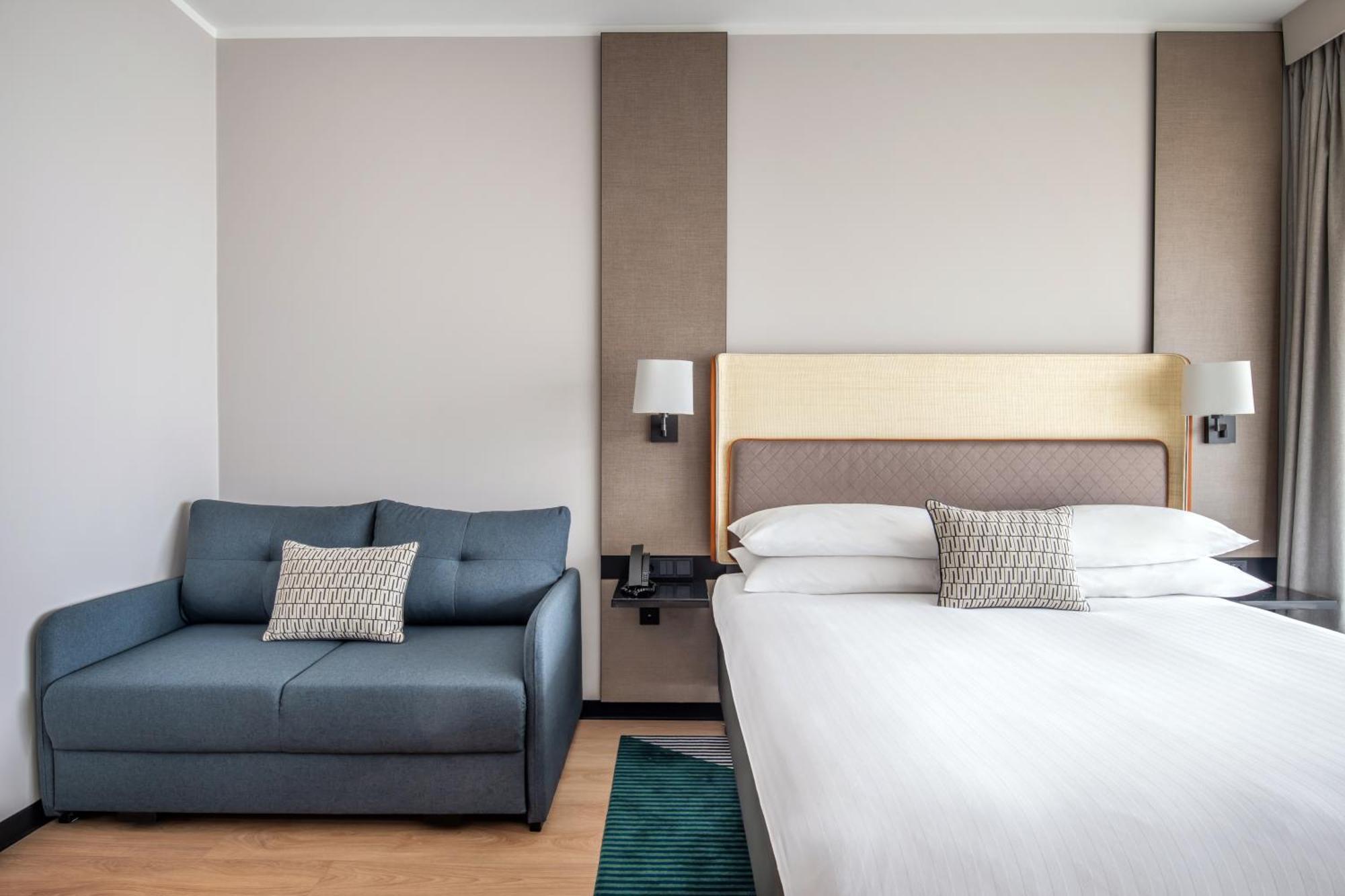 Familiekamer met 1 Kingsize Bed en Slaapbank - Balkon