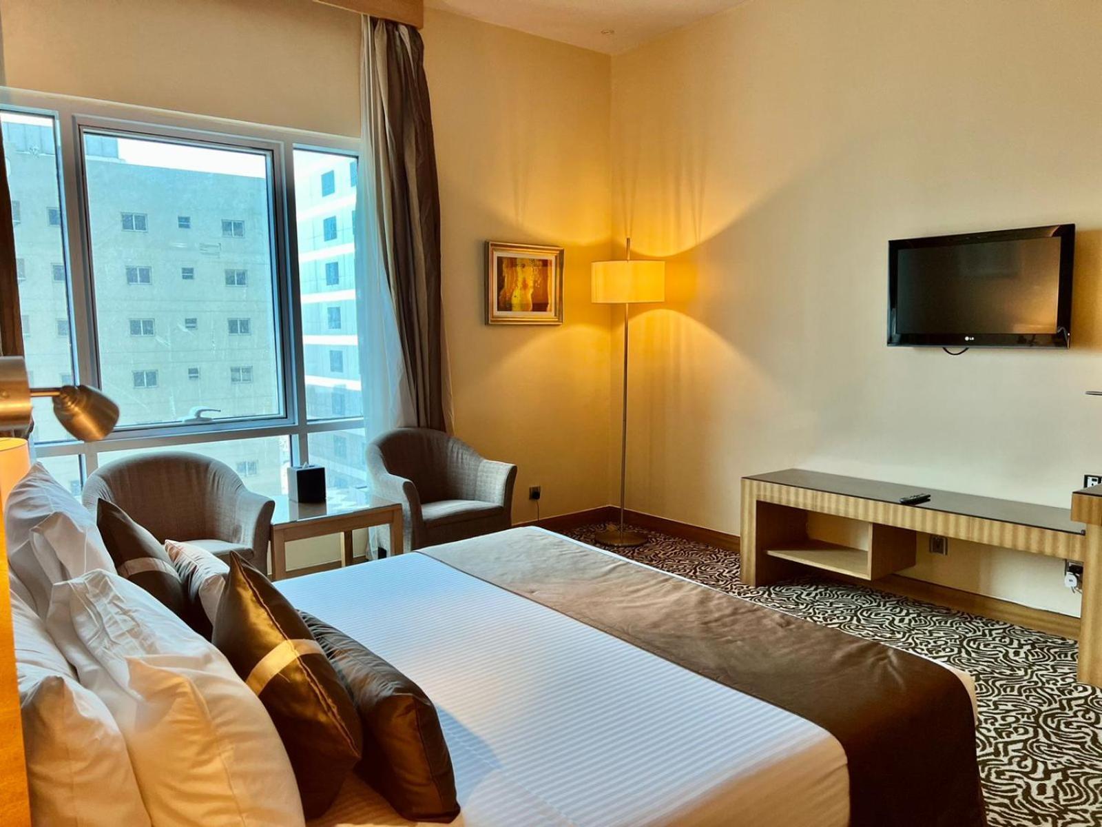Deluxe Kamer met 1 Kingsize Bed.