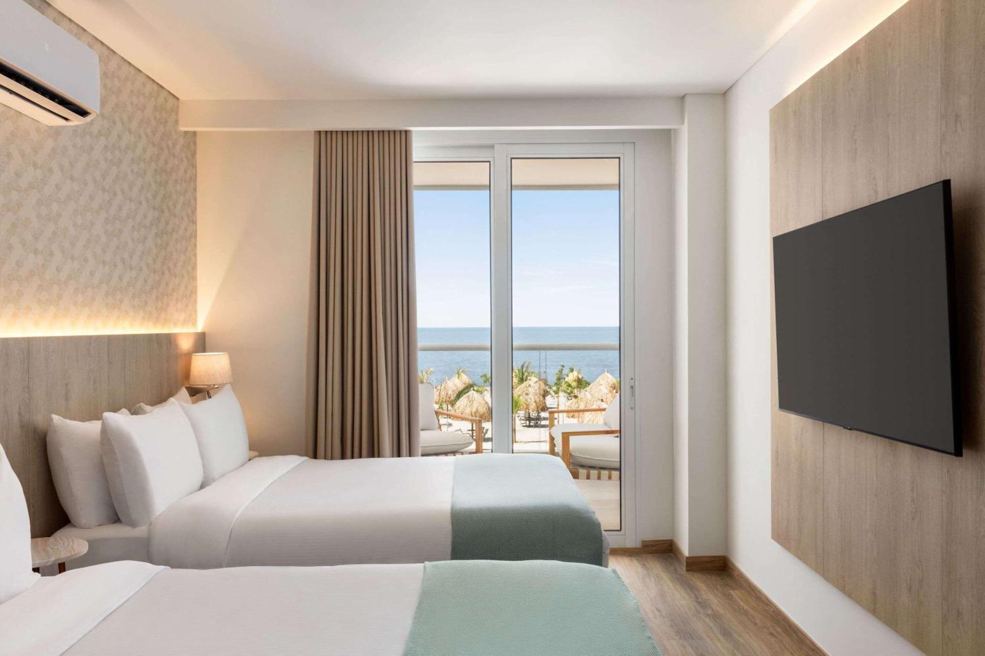 Apartamento de 2 dormitorios con 2 camas extragrandes, 2 camas individuales y vistas al mar
