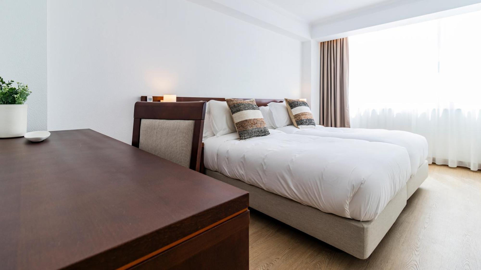 Zweibettzimmer mit Meerblick