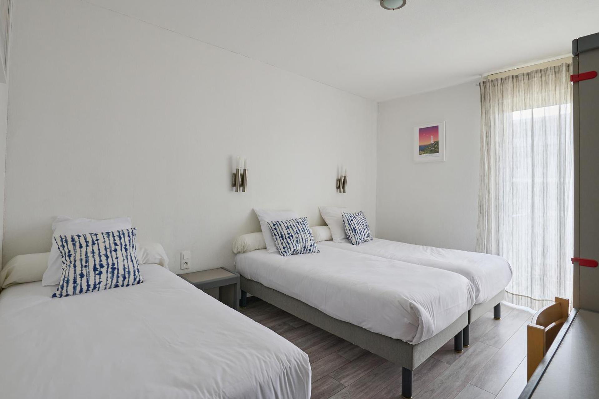 Comfort Dreibettzimmer mit 3 Einzelbetten - Innenhofseite