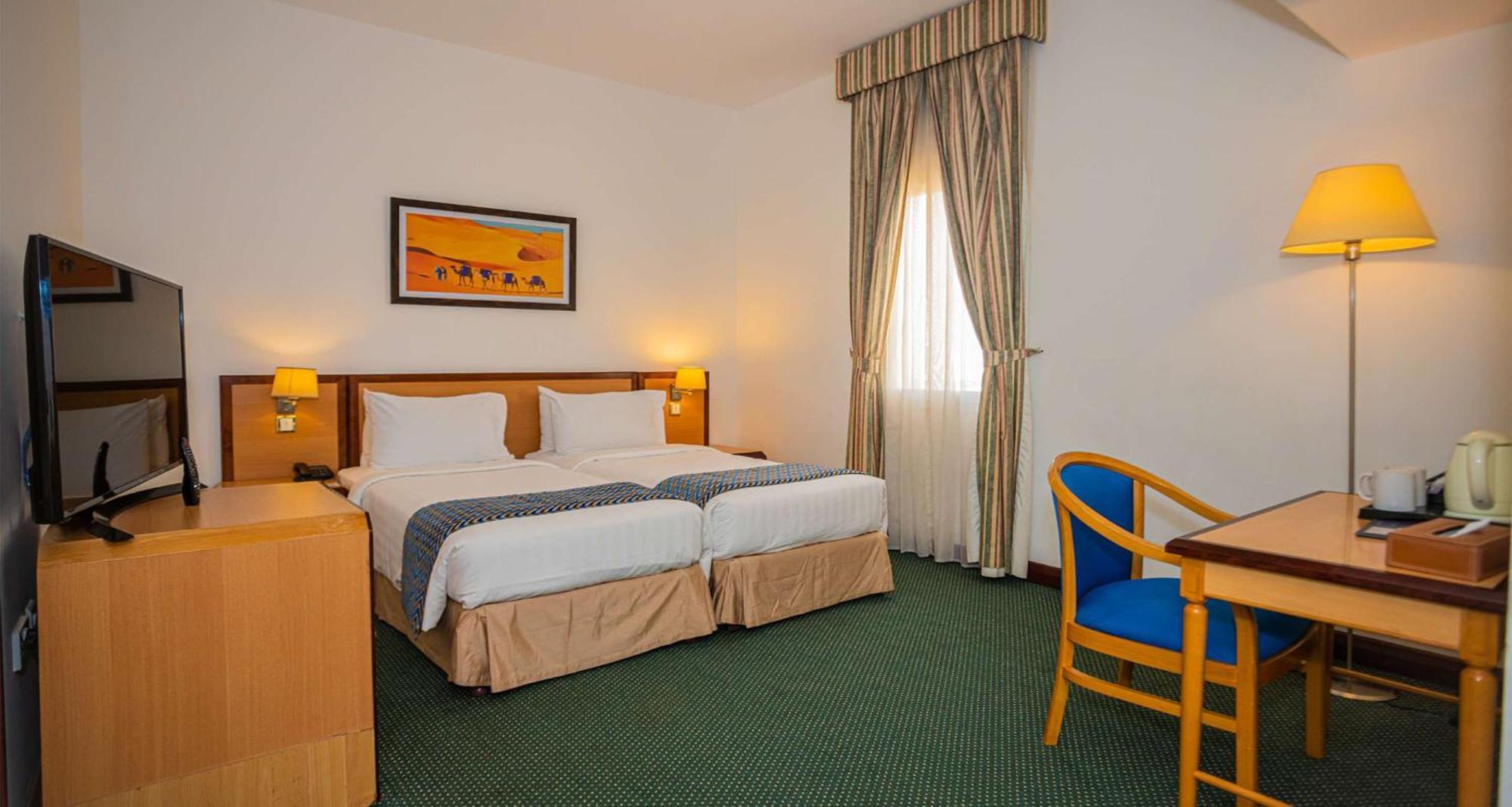 Familiensuite mit 1 Kingsize-Bett und 2 Einzelbetten - Nichtraucher