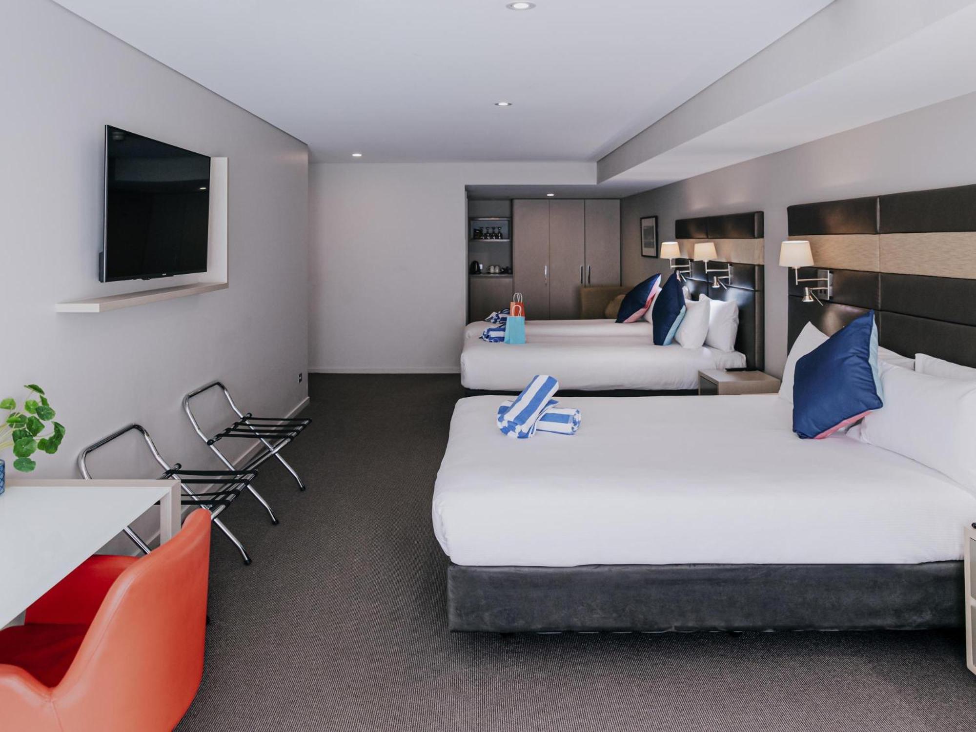 Superior Family Room with One Queen Bed, Two Single Beds and Bath