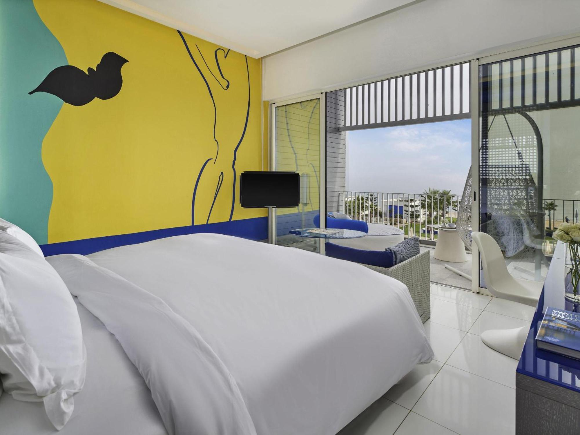 Chambre Deluxe 1 Lit King-Size avec Terrasse Privée - Vue sur Mer
