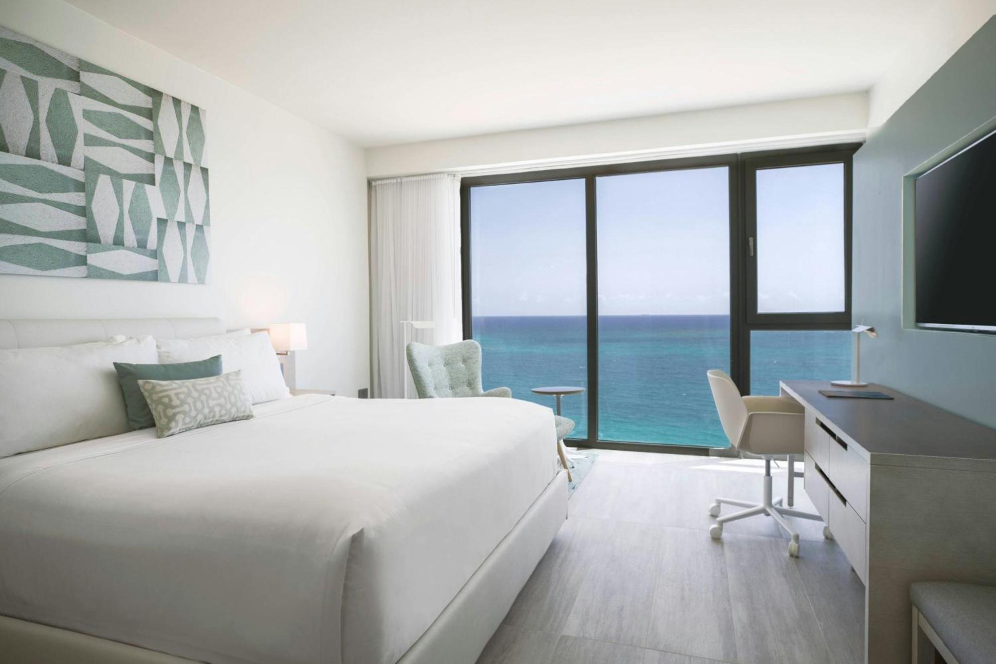One-Bedroom Deluxe King Suite Sofa Bed Partial Ocean View