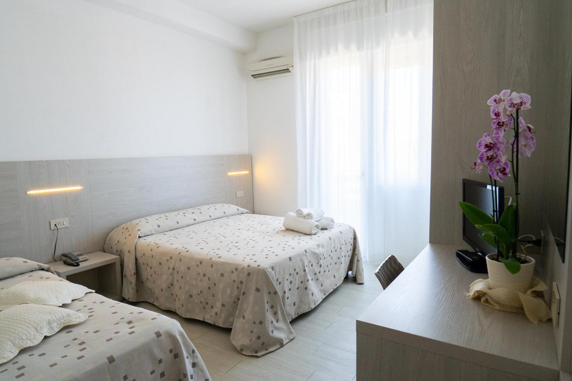 Dreibettzimmer mit Balkon