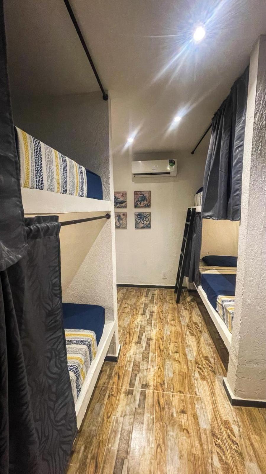 Cama en habitación compartida de 6 camas
