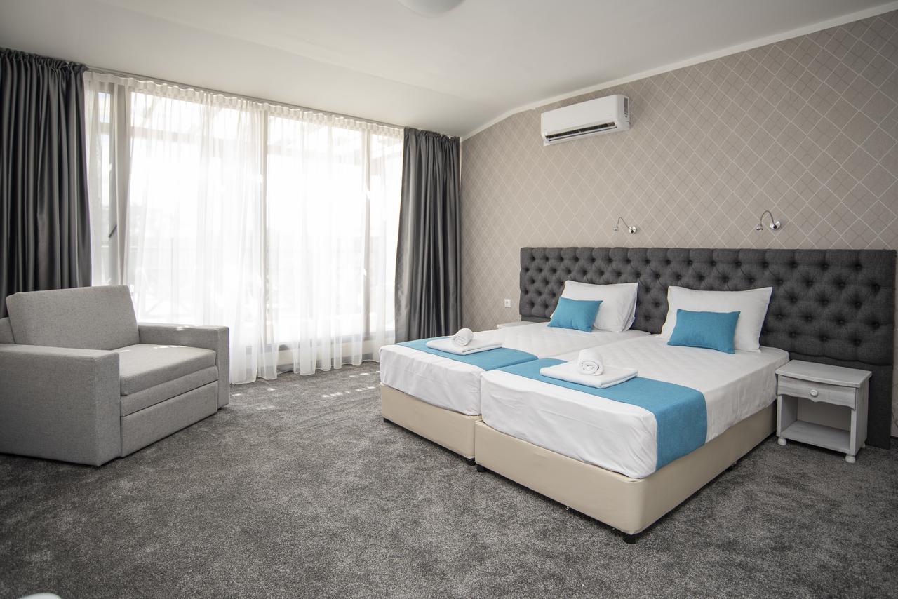 Deluxe Double Room with Balcony and Side Sea View (2 Adults + 1 Child)